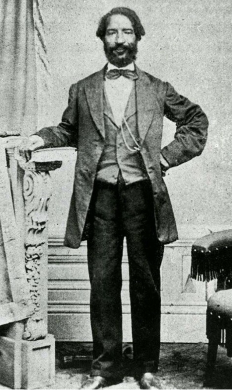 A photo of William Donegan in a suit